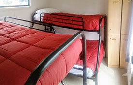 self-contained 1-bedroom cabin bedroom